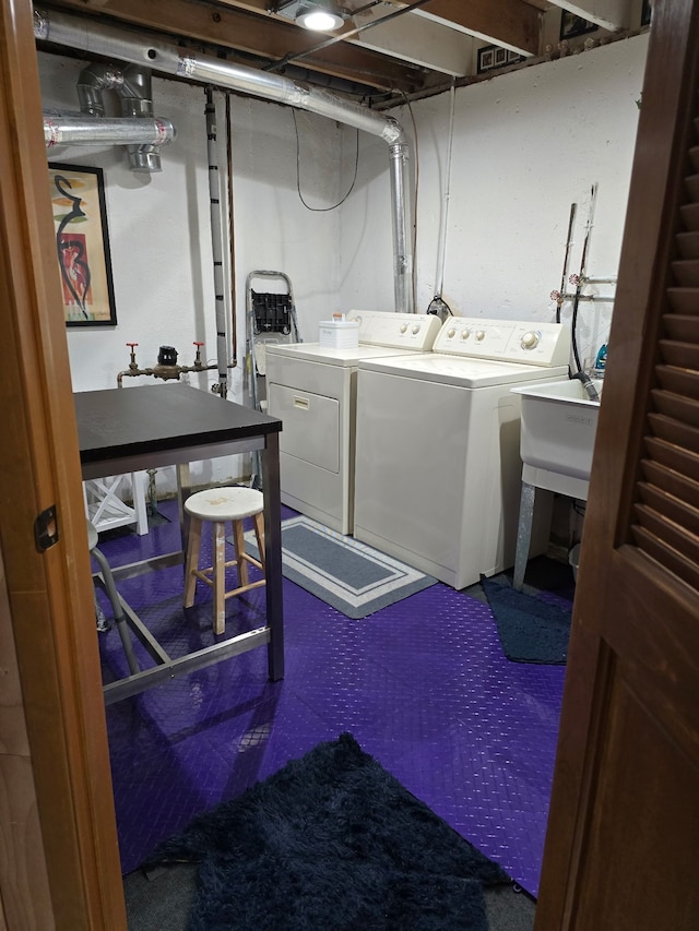 washroom featuring separate washer and dryer and sink