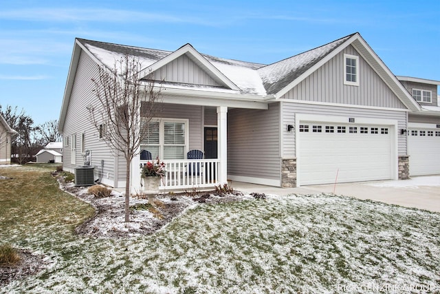 view of front facade with central AC, a yard, and covered porch