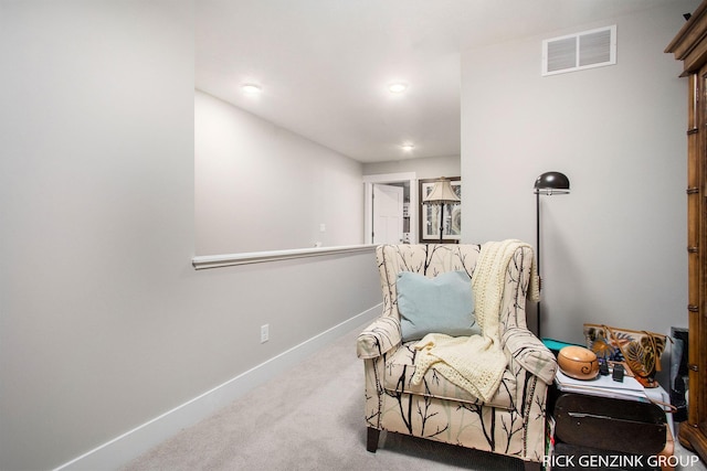 sitting room with carpet flooring