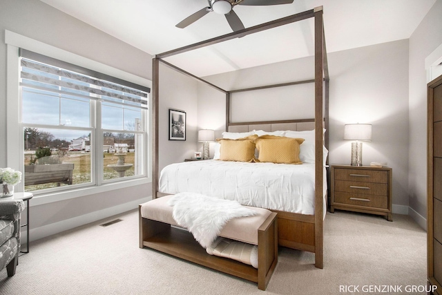 bedroom featuring light colored carpet and ceiling fan