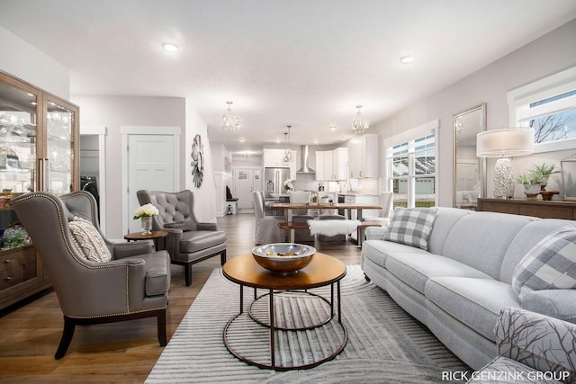 living room featuring a healthy amount of sunlight and dark hardwood / wood-style floors