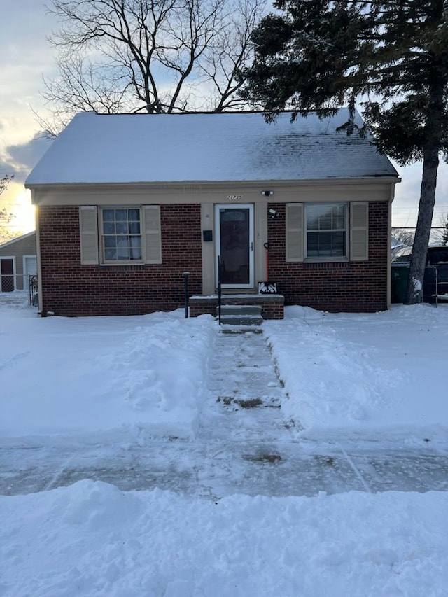 view of front of home featuring brick siding