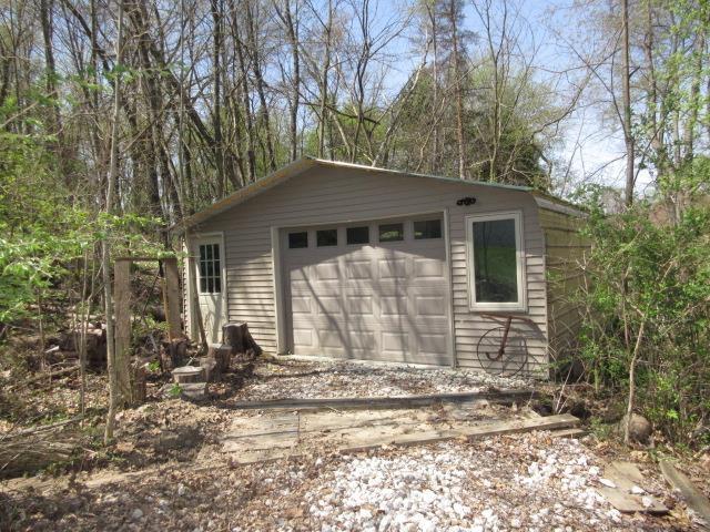 10480 Denton Creek Dr, Fenton, MI 48430 - detached garage with dirt driveway