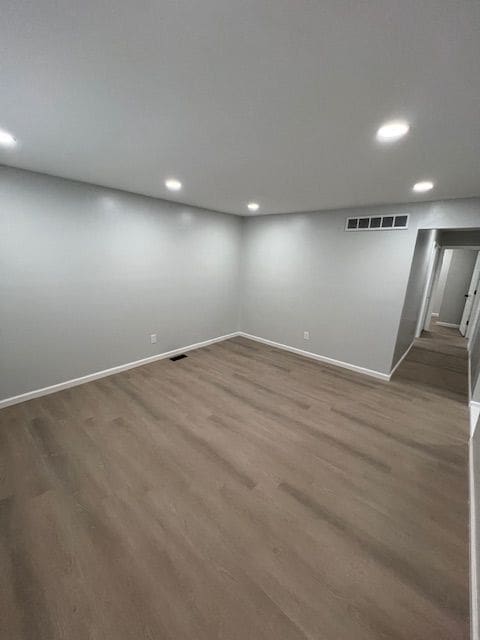 basement with wood-type flooring