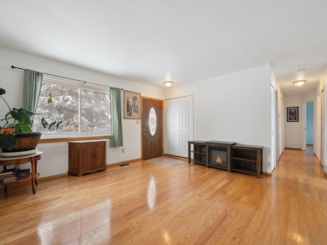 entryway with light hardwood / wood-style flooring