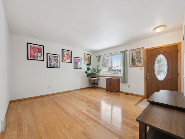 foyer with light hardwood / wood-style floors