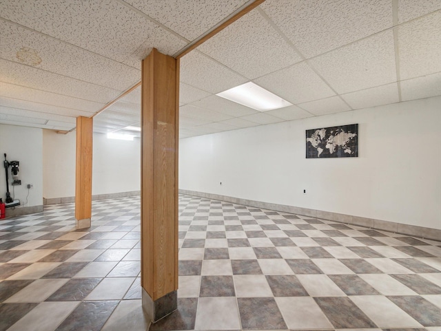 basement featuring a drop ceiling