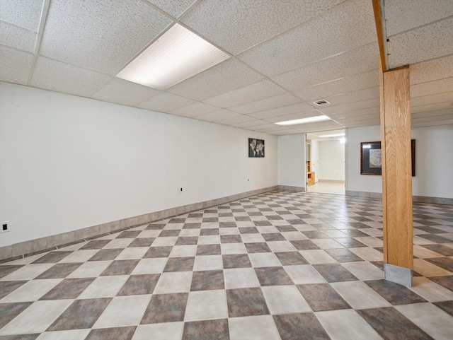 basement featuring a drop ceiling