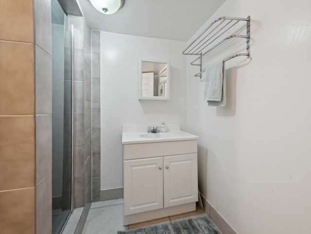 bathroom with vanity and a shower with shower door