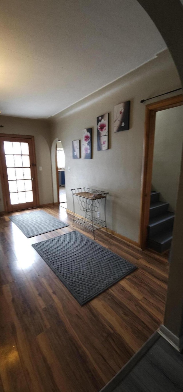 entryway with dark hardwood / wood-style floors