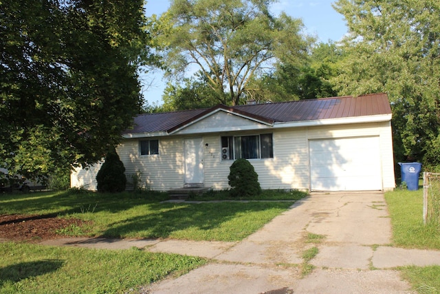 ranch-style home featuring a garage and a front yard