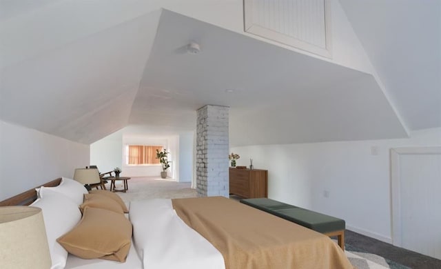 bedroom with lofted ceiling, decorative columns, and carpet