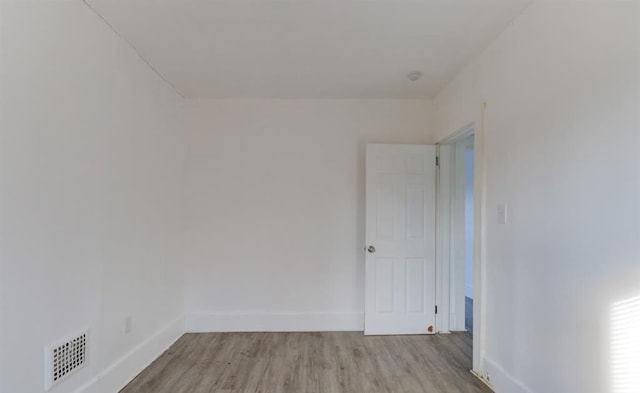 spare room with light hardwood / wood-style floors