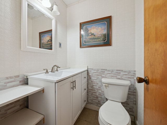 bathroom featuring vanity, tile patterned flooring, and toilet