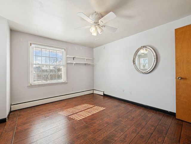 unfurnished room with ceiling fan, dark hardwood / wood-style floors, and a baseboard radiator