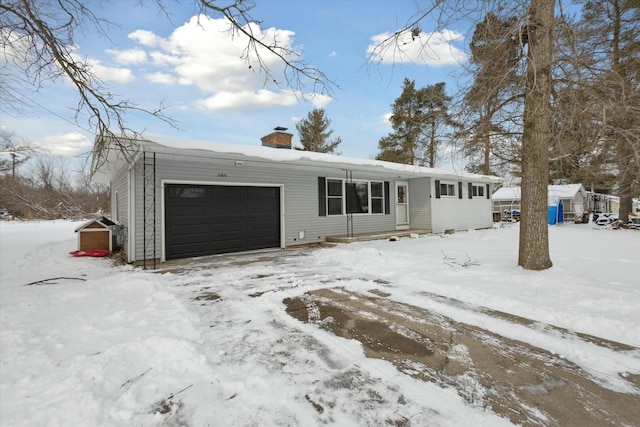 single story home with a garage