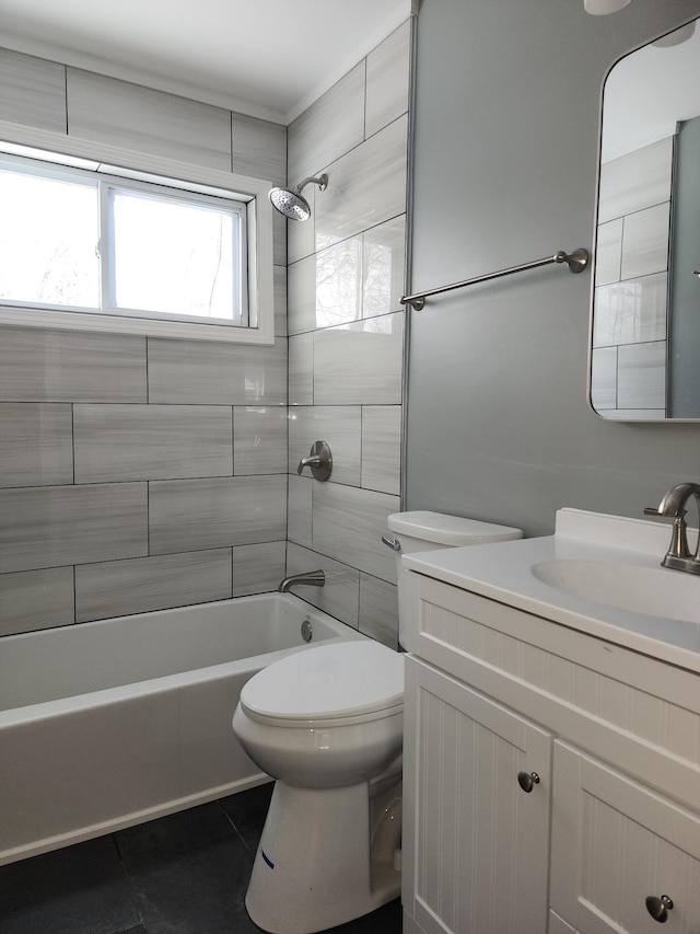 full bathroom with vanity, toilet, and tiled shower / bath combo