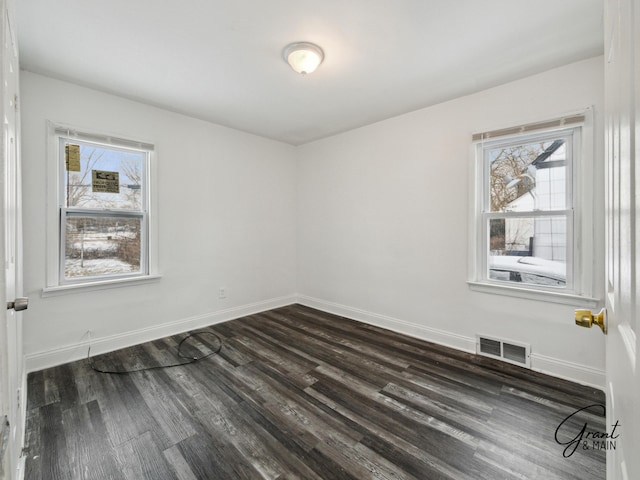 9941 Minock St, Detroit, MI 48228 - unfurnished room featuring dark wood-type flooring and plenty of natural light
