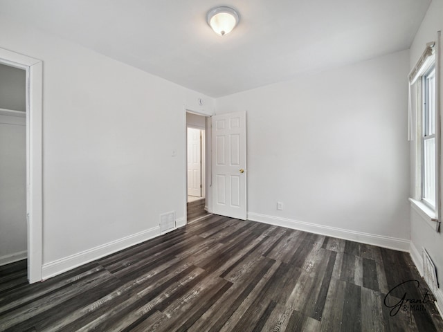 9941 Minock St, Detroit, MI 48228 - unfurnished bedroom with dark wood-type flooring and a closet