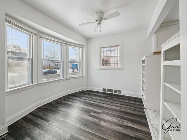 9941 Minock St, Detroit, MI 48228 - empty room featuring dark wood-type flooring and ceiling fan