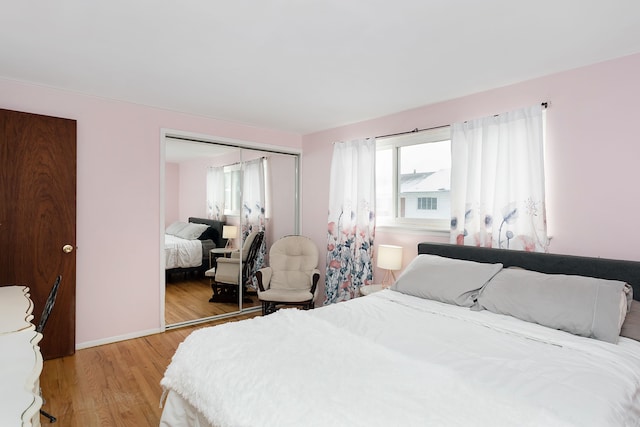 bedroom featuring a closet and light hardwood / wood-style flooring