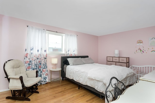 bedroom with light wood-type flooring