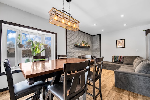 dining space featuring recessed lighting and light wood finished floors