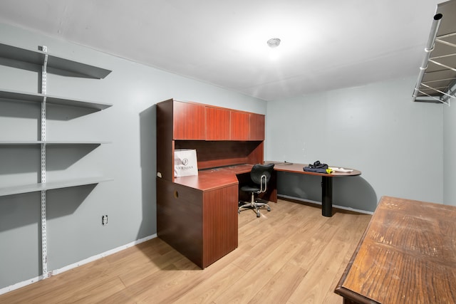 office featuring light wood-style flooring and baseboards