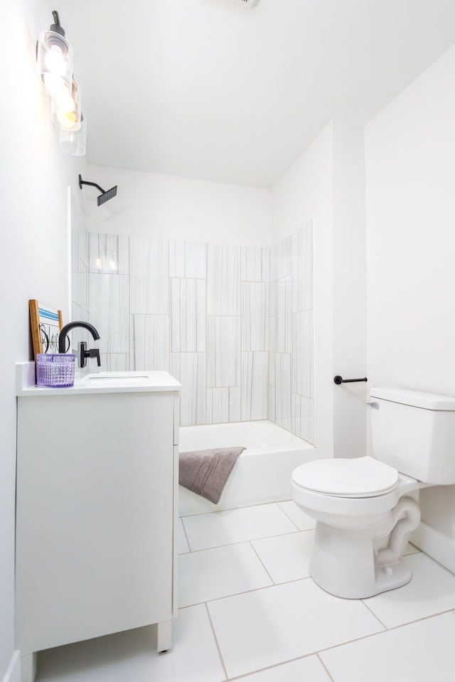 bathroom with toilet, tile patterned flooring, washtub / shower combination, and vanity