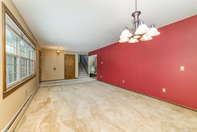 unfurnished room featuring a textured ceiling, stairway, carpet flooring, baseboard heating, and a chandelier