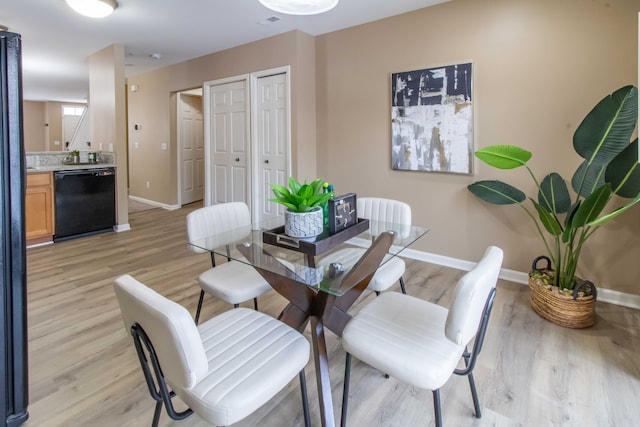 dining space featuring light hardwood / wood-style flooring