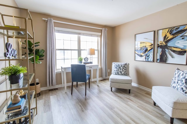 sitting room with light wood-type flooring