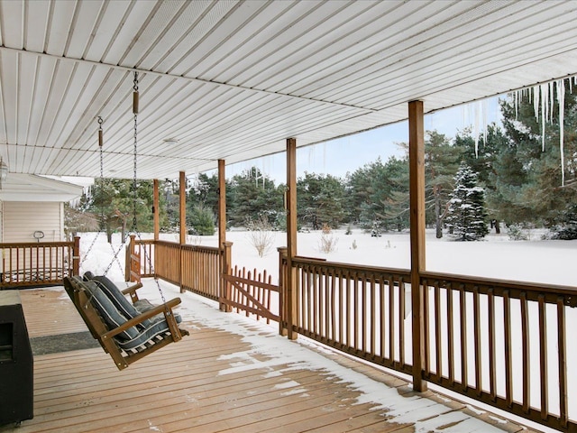 view of snow covered deck