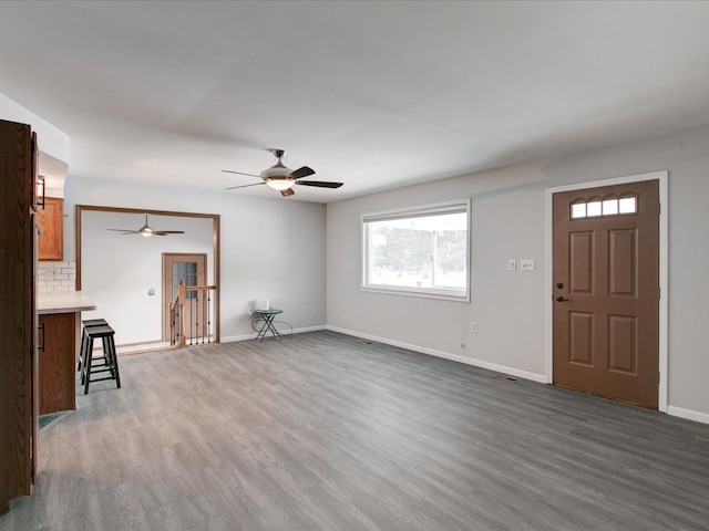 unfurnished living room with dark hardwood / wood-style floors