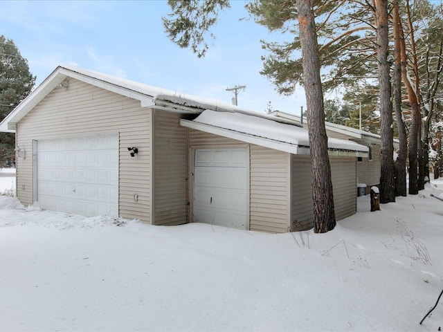 view of snow covered garage