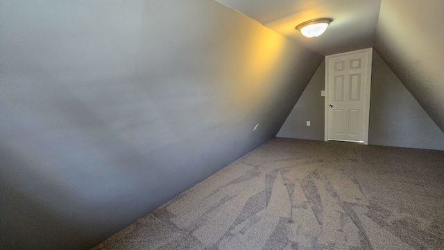 bonus room featuring lofted ceiling and carpet floors