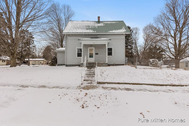 view of snow covered house