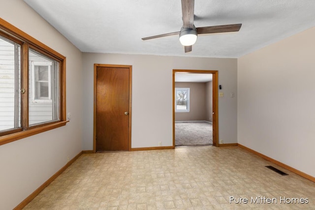 unfurnished bedroom with a textured ceiling and ceiling fan