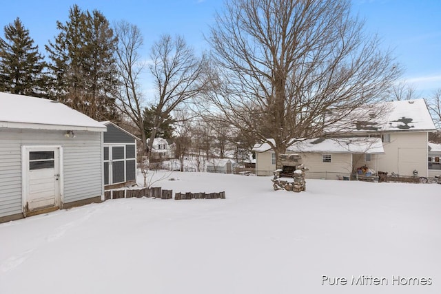 view of yard covered in snow