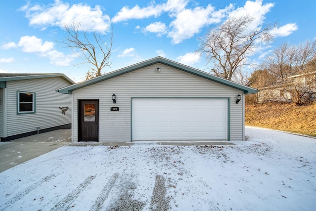 view of snow covered garage