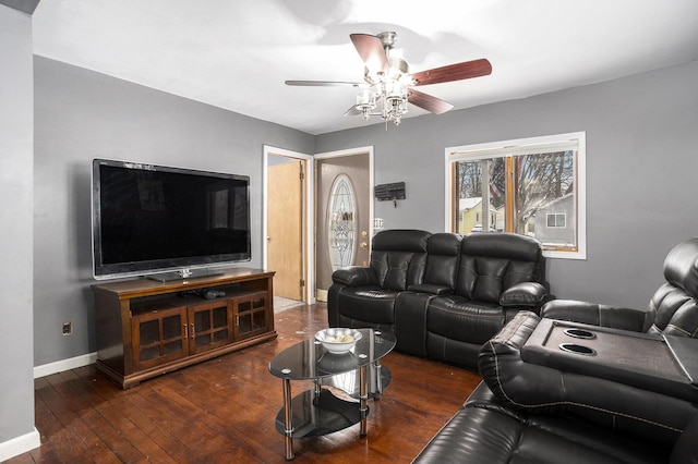 living room featuring dark wood-type flooring and ceiling fan