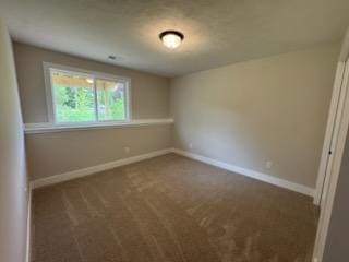 unfurnished bedroom with carpet flooring and baseboards