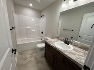 bathroom featuring toilet, vanity, and washtub / shower combination