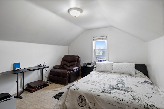 bedroom with light carpet and lofted ceiling