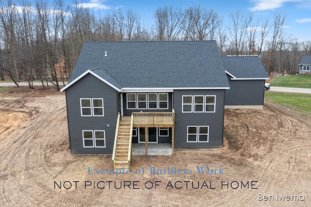 rear view of property with a wooden deck