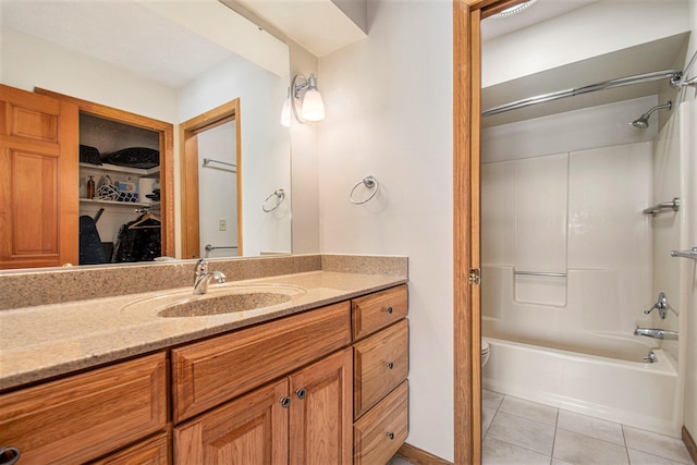 full bathroom featuring shower / bath combination, tile patterned flooring, vanity, and toilet