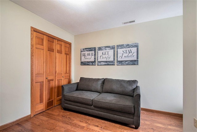 sitting room featuring hardwood / wood-style floors