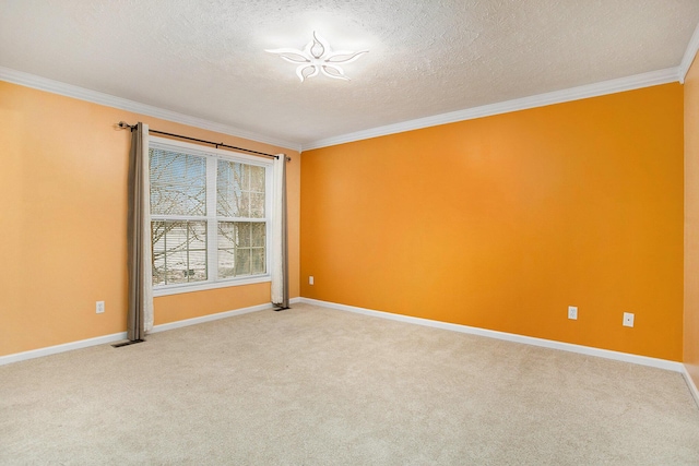 carpeted spare room featuring crown molding and a textured ceiling