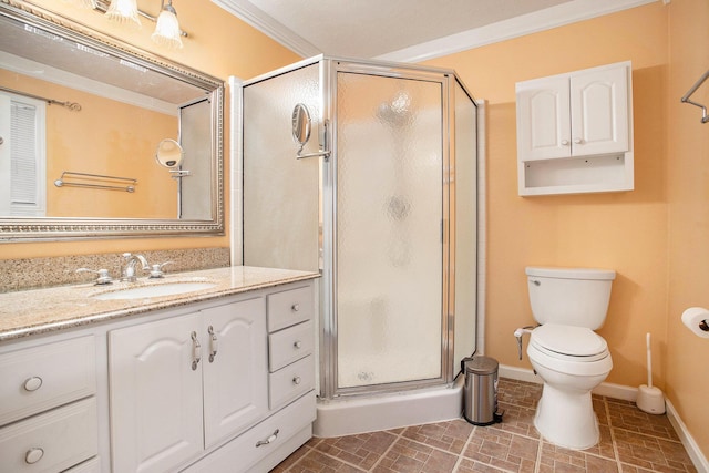 bathroom with an enclosed shower, toilet, vanity, and crown molding