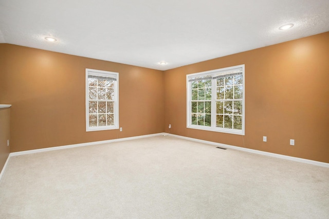 unfurnished room with carpet floors